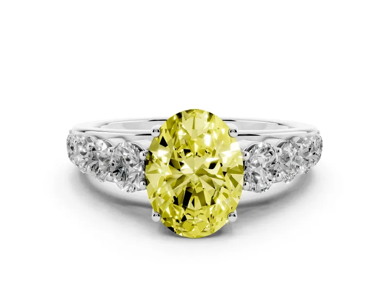 Fancy Yellow Oval Cut Diamond Solitaire Ring Set in White gold with Pavé-Set Band and Prong Setting