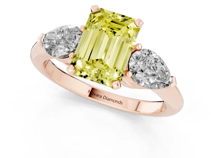 Fancy Yellow Three-Stone Emerald Cut Diamond Ring Set in Rose gold with Pear Side Stones and Prong Setting