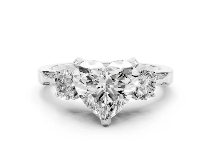 Heart Cut Diamond Three-Stone Ring Set in Platinum with Pavé Band and Smaller Side Stones