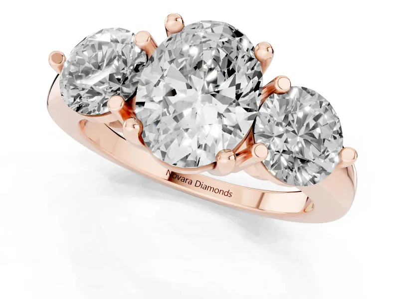 Oval Cut Diamond Three-Stone Ring Set in Rose gold with Prong Setting and Classic Band