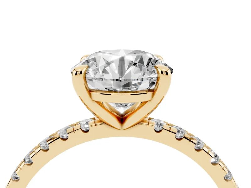 Round Cut Diamond Brilliant Solitaire Ring Set in Yellow gold with Pavé Band and Prong Setting