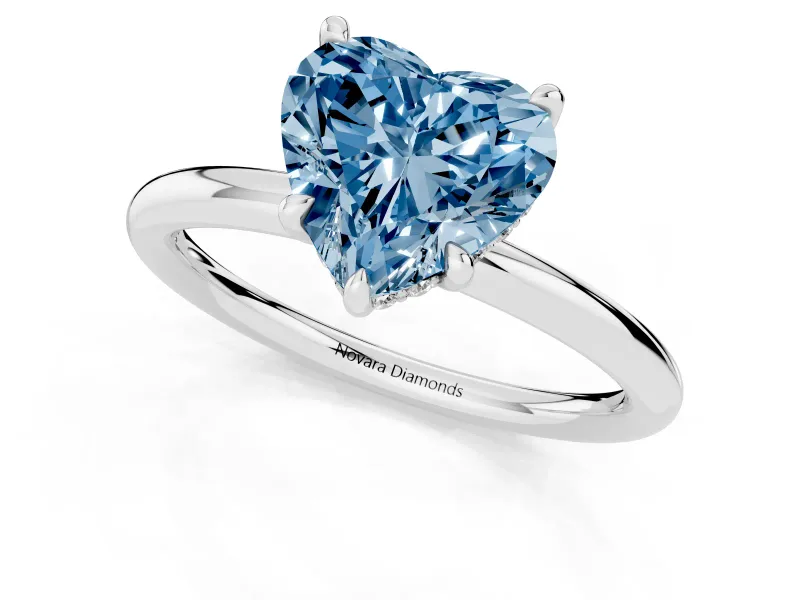 Fancy Blue Heart Cut Diamond Solitaire Ring Set in White gold with Thin Band and Prong Setting