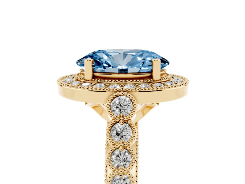 Fancy Blue Oval Cut Diamond Milgrain Halo Solitaire Ring Set in Yellow gold with Bezel Set Side Stones and Pavé Band