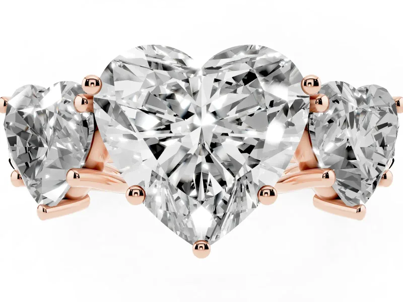 Heart Cut Diamond Three-Stone Ring Set in Rose gold with Pavé Band