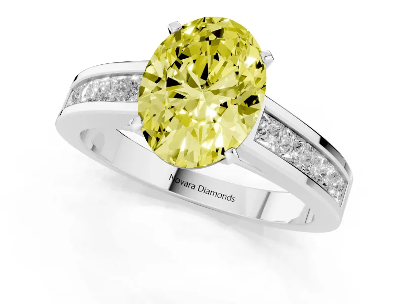 Fancy Yellow Oval Cut Diamond Solitaire Ring Set in Silver with Channel-Set Band and Prong Setting