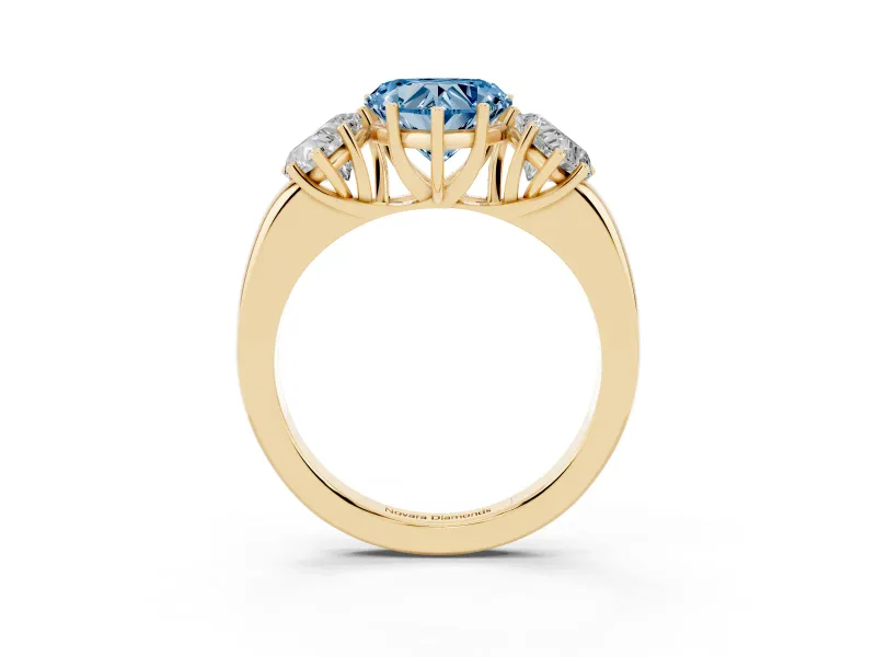 Fancy Blue Heart Cut Diamond Three-Stone Ring Set in Yellow gold with Bold Center and Classic Band
