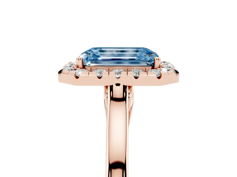 Fancy Blue Emerald Cut Halo Round Diamond Solitaire Ring Set in Rose gold with Pavé Band and Prong Setting