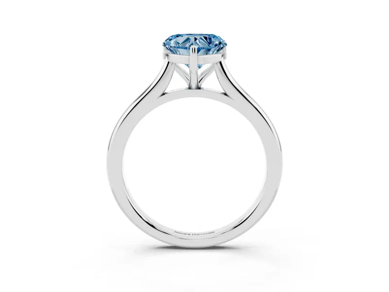 Fancy Blue Heart Cut Diamond Solitaire Ring Set in Silver with Cathedral Band and Prong Setting