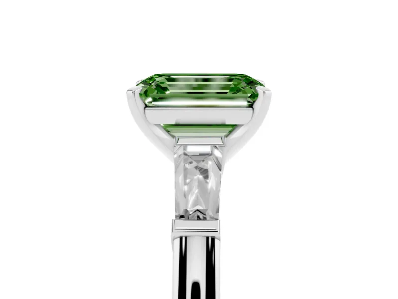 Fancy Green Emerald Cut Diamond Solitaire Ring Set in Platinum with Tapered Baguette Side Stones and Prong Setting