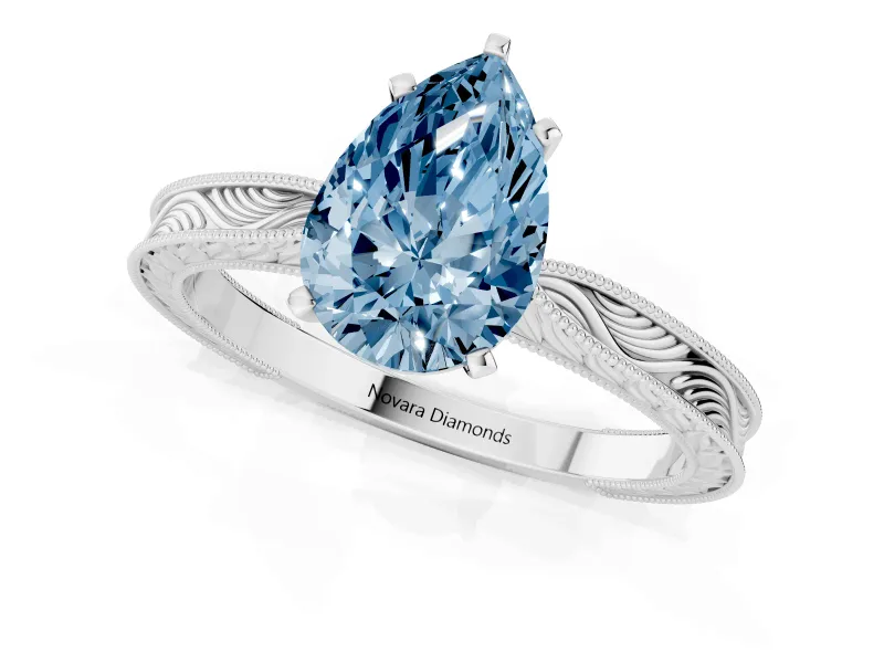 Fancy Blue Pear Cut Diamond Solitaire Milgrain Engraved Band Set in Silver with Prong Setting