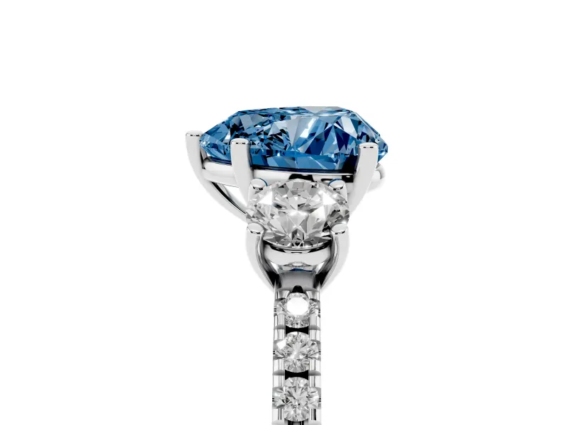 Fancy Blue Heart Cut Diamond Three-Stone Ring Set in White gold with Pavé Band and Graduated Sides