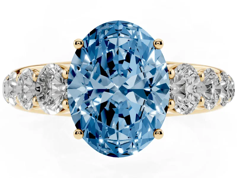Oval Graduated Side Stone Engagement Ring Setting for a Fancy Blue Lab-Grown Diamond | Flat Top Band | Yellow Gold