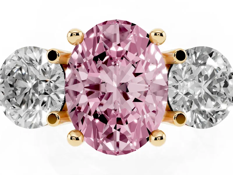 Fancy Pink Oval Cut Diamond Three-Stone Ring Set in Yellow gold with Prong Setting and Classic Band