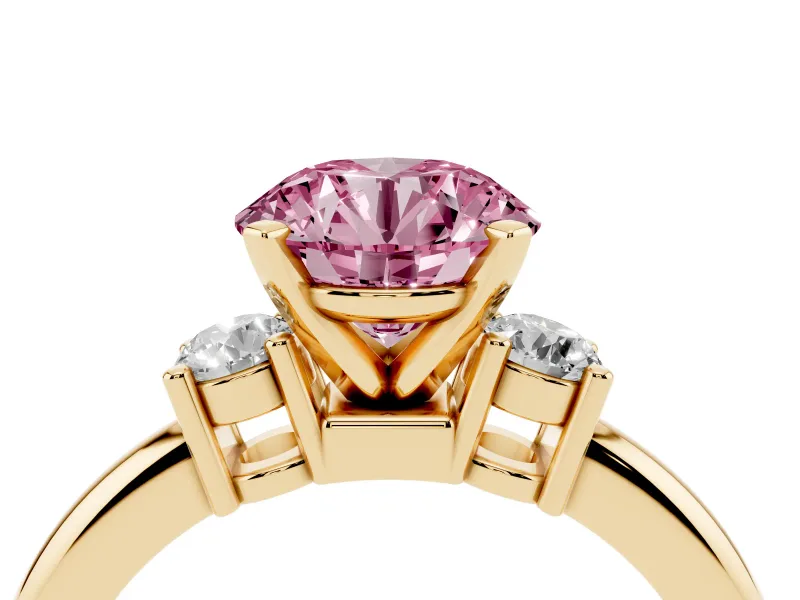 Fancy Pink Three-Stone Round Cut Diamond Ring Set in Yellow gold with Prong Setting and Plain Band