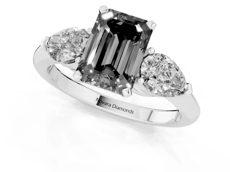 Fancy Black Three-Stone Emerald Cut Diamond Ring Set in Platinum with Pear Side Stones and Prong Setting