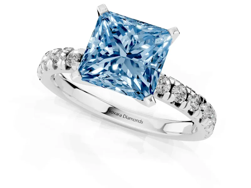 Fancy Blue Princess Cut Diamond Solitaire Pavé Engagement Ring Set in Platinum with Round Band and Prong Setting