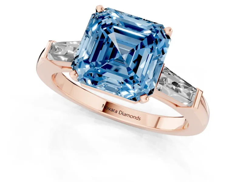 Fancy Blue Asscher Cut Diamond Solitaire Ring Set in Rose gold with Tapered Baguette Side Stones and Prong Setting