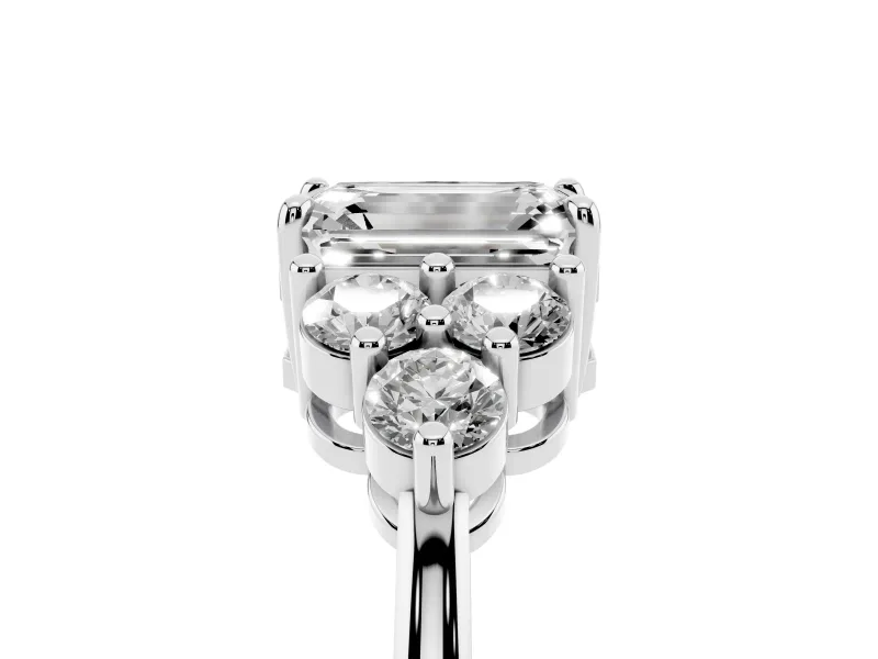 Emerald Cut Diamond Solitaire Ring Set in Silver with Cluster Accents on Each Side