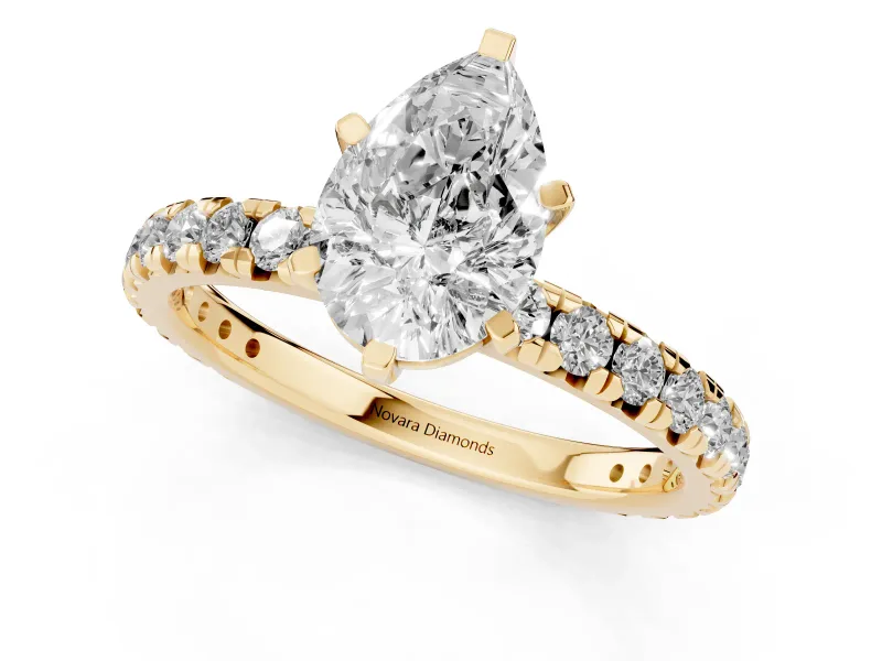 Pear Cut Diamond Pavé Solitaire Ring Set in Yellow gold with Round Band and Prong Setting