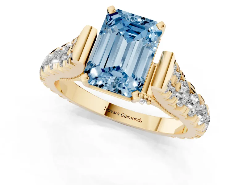 Fancy Blue Emerald Cut Diamond Classic Solitaire Ring Set in Yellow gold with Pavé Band and Prong Setting