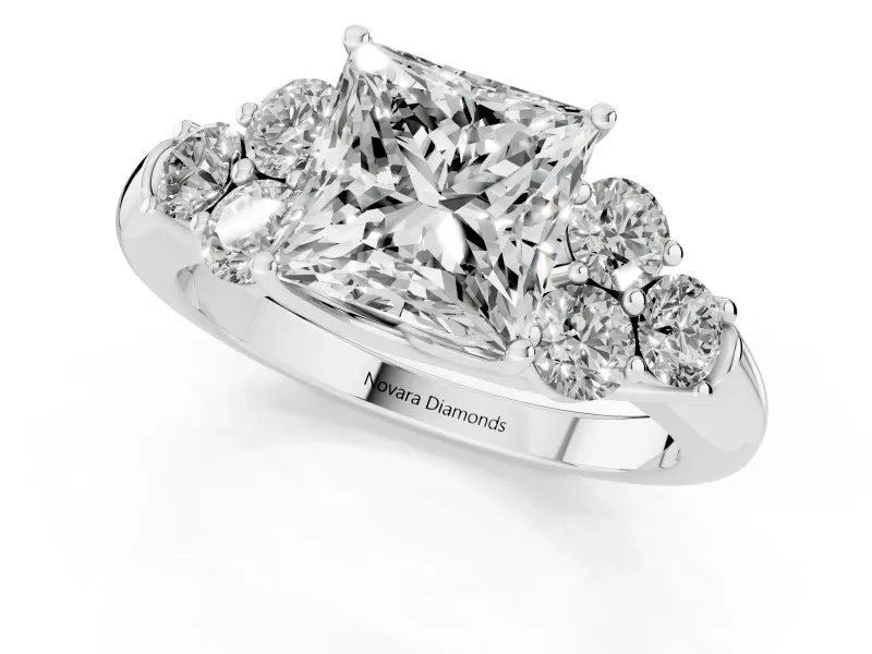 Princess Cut Diamond Cluster Ring Set in White gold with Round Accent Stones and Prong Setting on a Plain Band