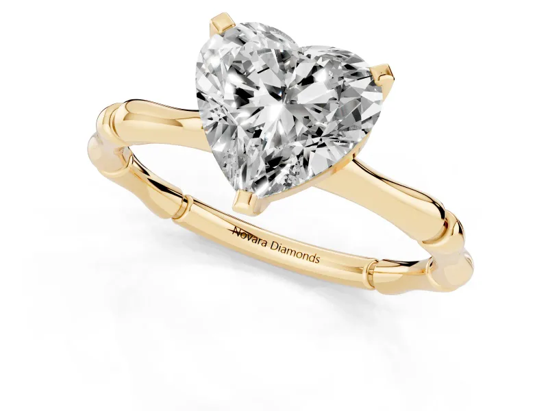 Heart Cut Diamond Solitaire Ring Set in Yellow gold with Bamboo Band and Prong Setting