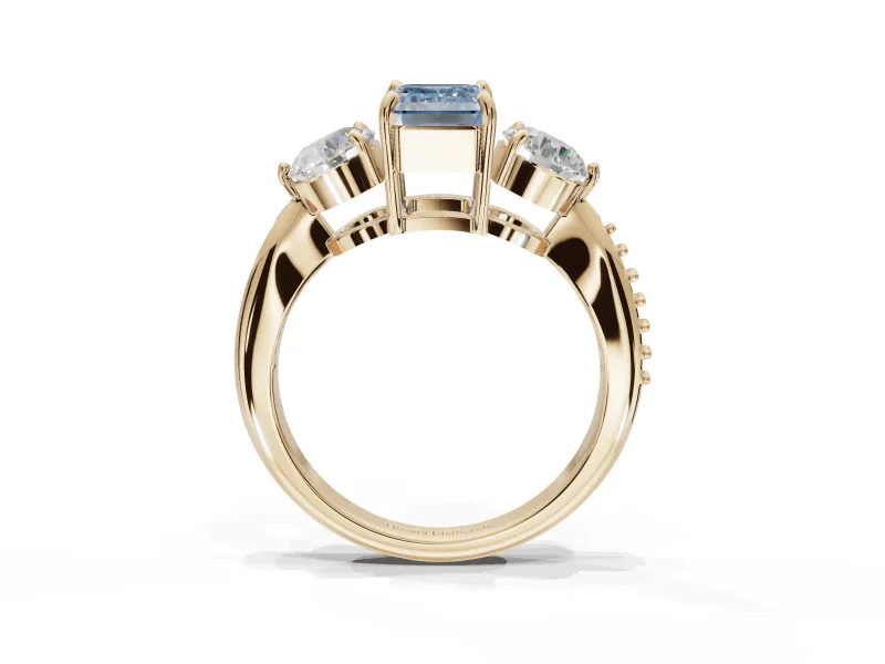 Emerald Cut Three Stone Engagement Ring Setting for a Fancy Blue Lab-Grown Diamond | Tapered Pave Band | Yellow Gold