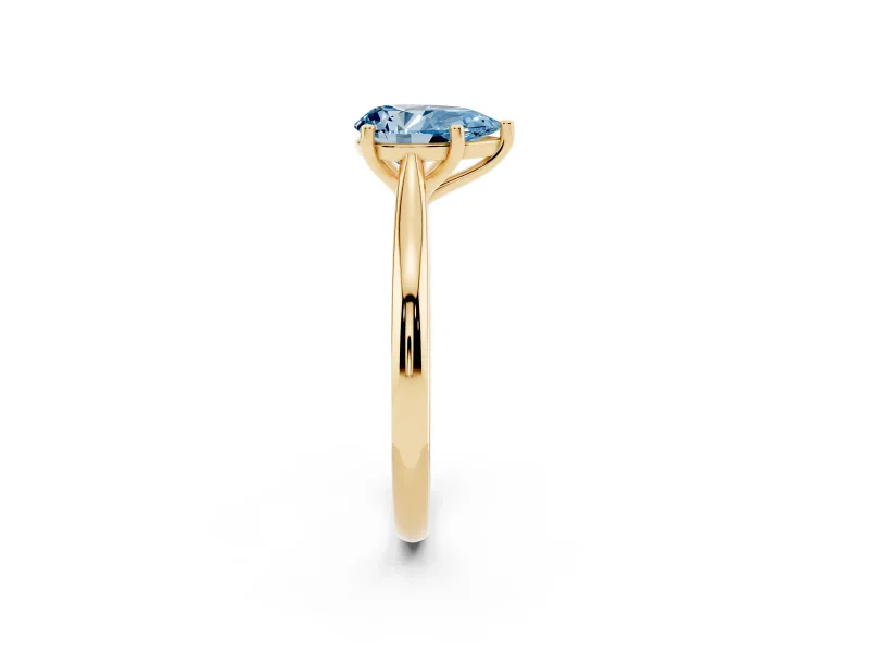 Fancy Blue Pear Cut Diamond Solitaire Ring Set in Yellow gold with Cathedral Band and Prong Setting