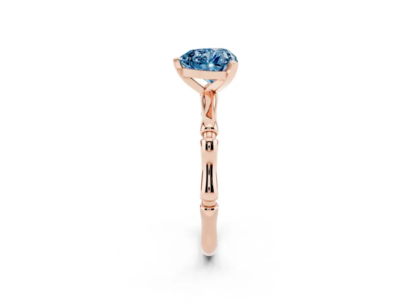 Fancy Blue Heart Cut Diamond Solitaire Ring Set in Rose gold with Bamboo Band and Prong Setting