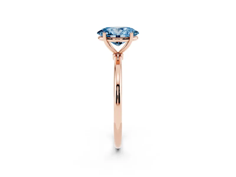 Fancy Blue Oval Cut Diamond Solitaire Engagement Ring Set in Rose gold with Thin Band and Prong Setting