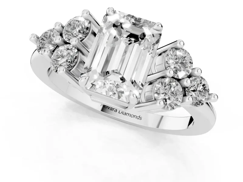 Emerald Cut Diamond Solitaire Ring Set in Silver with Cluster Accents on Each Side