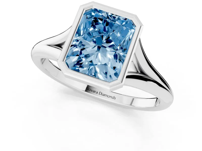 Fancy Blue Bezel Set Radiant Cut Diamond Solitaire Ring Set in Silver with Tapered Band