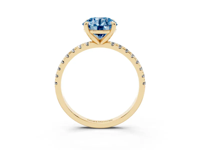 Fancy Blue Round Cut Diamond Brilliant Solitaire Ring Set in Yellow gold with Pavé Band and Prong Setting