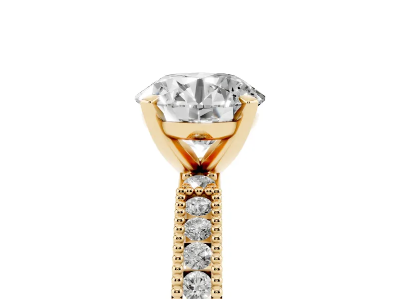 Round Cut Diamond Solitaire Ring Set in Yellow gold with Slim Pavé Band and Prong Setting