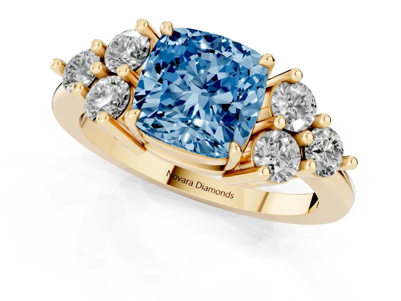 Fancy Blue Cushion Cut Diamond Solitaire Ring Set in Yellow gold with Cluster Accents on Each Side