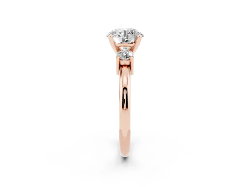Three-Stone Round Cut Diamond Ring Set in Rose gold with Prong Setting and Plain Band