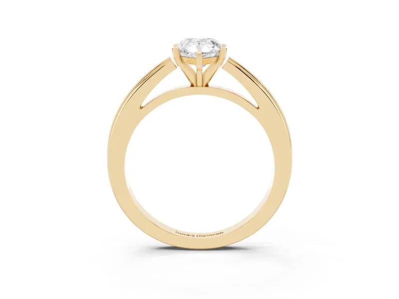 Pear Cut Diamond Solitaire Ring Set in Yellow gold with Prong Setting and Classic Band
