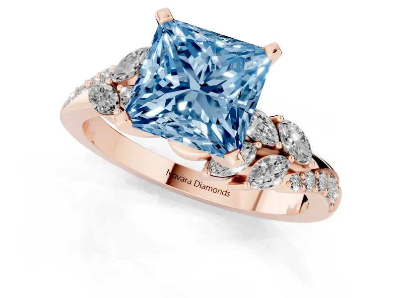 Fancy Blue Princess Cut Diamond Solitaire Ring Set in Rose gold with Marquise Twist Band and Prong Setting