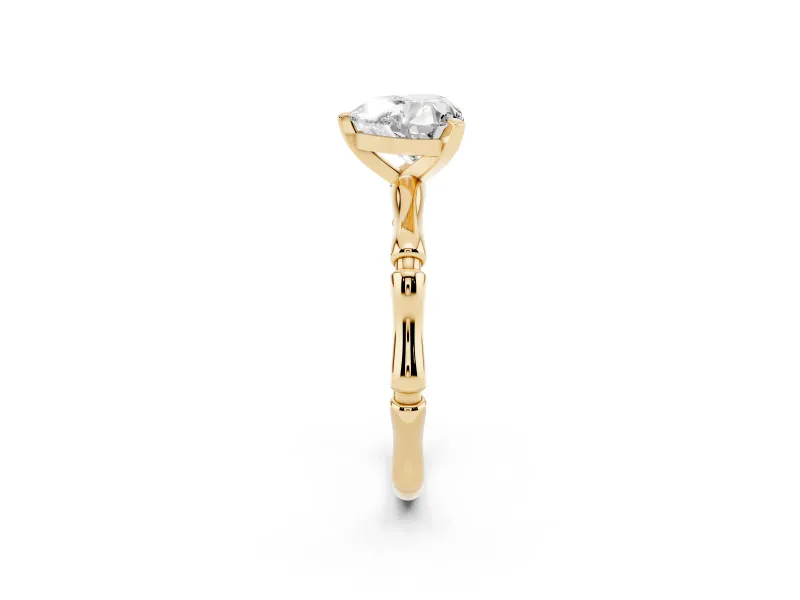 Heart Cut Diamond Solitaire Ring Set in Yellow gold with Bamboo Band and Prong Setting