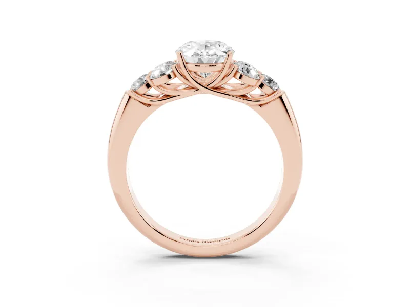 Oval Cut Diamond Cluster Ring Set in Rose gold with Round Accent Stones and Prong Setting on a Plain Band