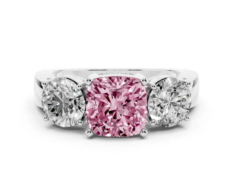 Fancy Pink Cushion Cut Diamond Three-Stone Ring Set in Platinum with Round Side Stones and Classic Band