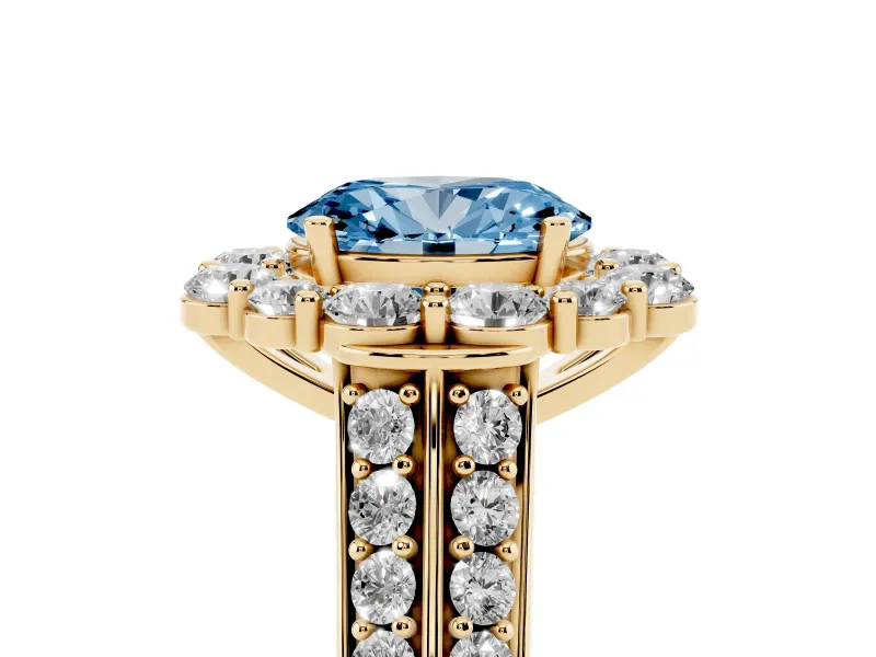 Fancy Blue Oval Cut Diamond Halo Engagement Ring Set in Yellow gold with Split Shank and Prong Setting