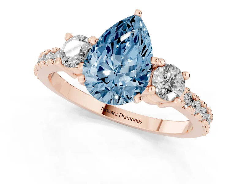 Fancy Blue Three-Stone Pear Cut Diamond Pavé Band Ring Set in Rose gold with Prong Setting