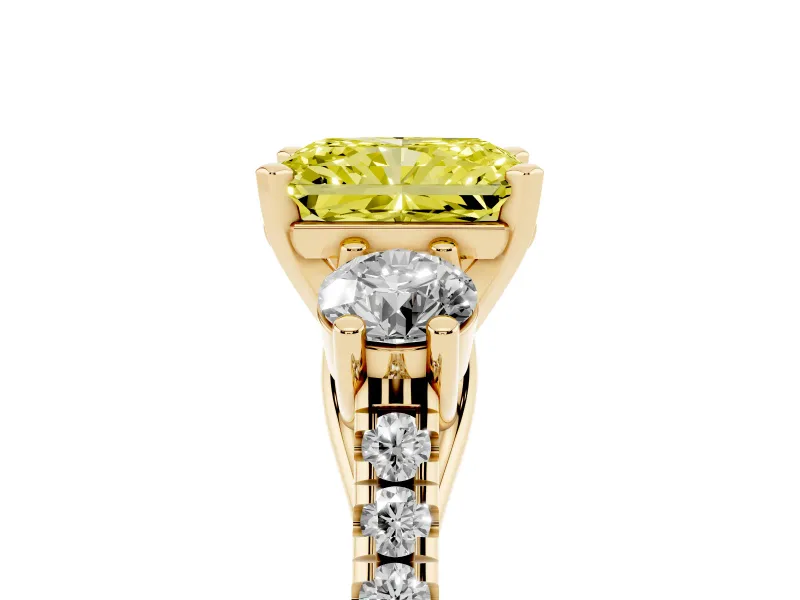 Fancy Yellow Three-Stone Radiant Cut Diamond Pavé Band Ring Set in Yellow gold with Prong-Set Trio