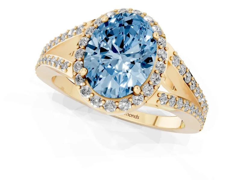 Fancy Blue Oval Cut Diamond Halo Split Shank Pavé Ring Set in Yellow gold with Prong Setting