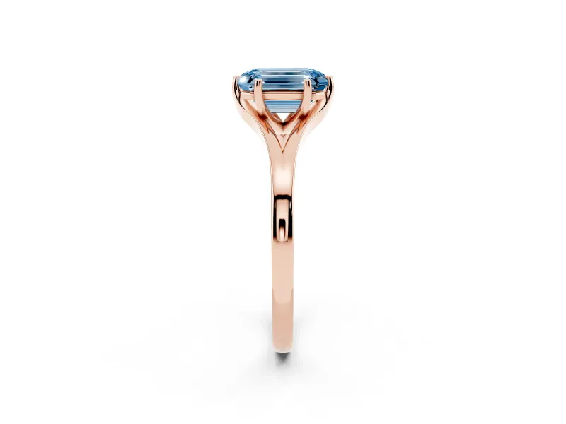 Fancy Blue Emerald Cut Diamond Solitaire Ring Set in Rose gold with Polished Tapered Band and Prong Setting