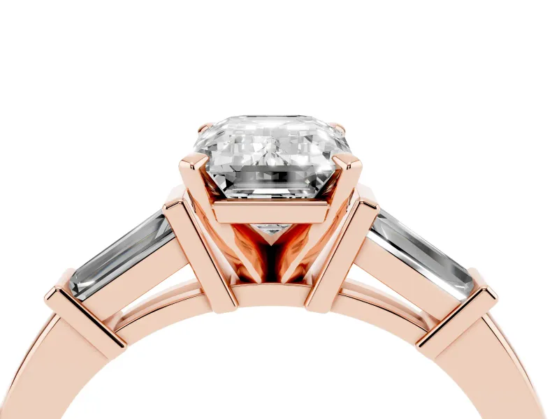 Emerald Cut Diamond Solitaire Ring Set in Rose gold with Tapered Baguette Accents and Prong Setting