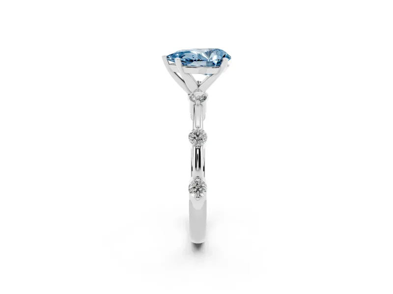 Fancy Blue Pear Cut Diamond Solitaire Ring Set in Platinum with Bezel Set Side Stones and Prong Setting