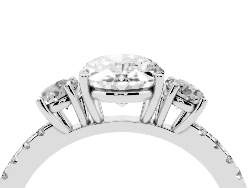 Oval Cut Diamond Three-Stone Ring Set in Platinum with Pavé Band and Graduated Sides