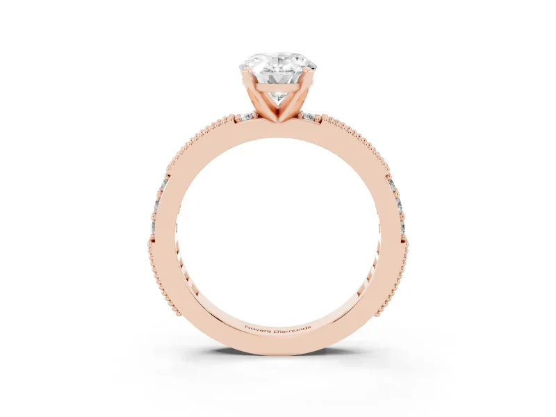 Oval Cut Diamond Solitaire Ring Set in Rose gold with Slim Pavé Band and Prong Setting